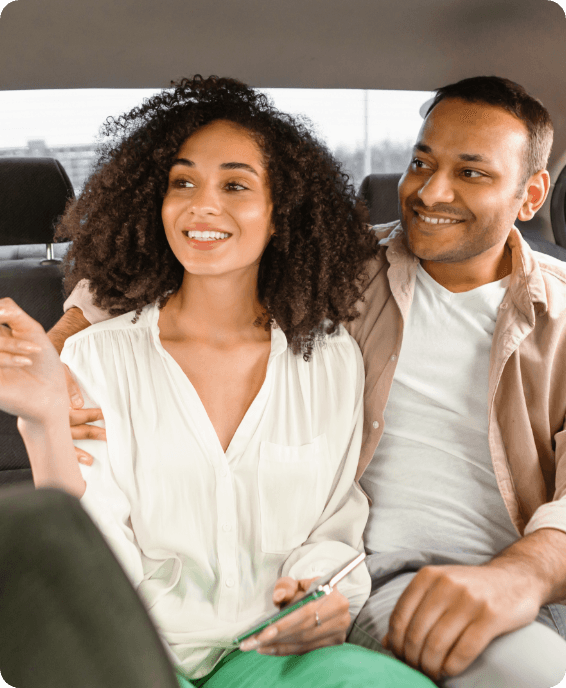 Two passengers relaxed in the back of a FOMO cab